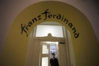 A worker opens the door at the Franz Ferdinand hostel in Sarajevo, January 29, 2014. REUTERS/Dado Ruvic