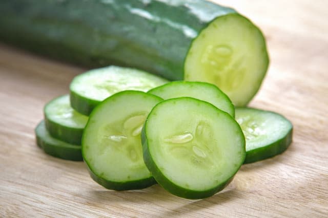 Fresh Cucumber  slices on wood background