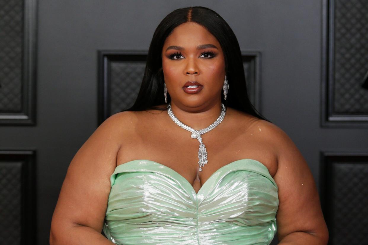 Headshot of Lizzo in Green Dress