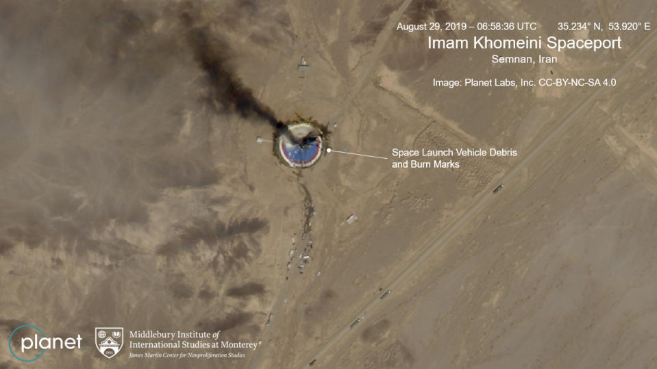 This satellite image from Planet Labs Inc., that has been annotated by experts at the James Martin Center for Nonproliferation Studies at Middlebury Institute of International Studies, shows a fire at a rocket launch pad at the Imam Khomeini Space Center in Iran's Semnan province, Thursday Aug. 29, 2019. The satellite image released Thursday shows the smoldering remains of a rocket at a Iran space center that was to conduct a U.S.-criticized satellite launch. (Planet Labs Inc, Middlebury Institute of International Studies via AP)