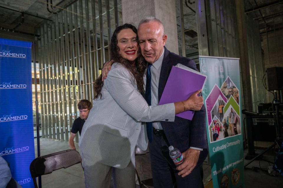 Elk Grove Mayor Bobbie Singh-Allen hugs Mayor Darrell Steinberg on Friday after he hosted his final panel discussion on the State of the City on the future of Sacramento’s climate, clean transportation and the Affordable Housing Act of 2024.