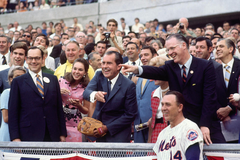 Nixon throws out the first pitch in Cincinnati at the 1970 All-Star Game in Cincinnati as commissioner Bowie Kuhn and Mets manager Gil Hodges observe. (Photo by Herb Scharfman/Sports Imagery/Getty Images)