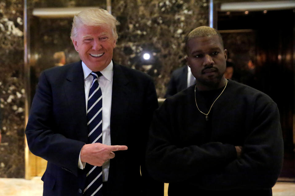 President-elect Donald Trump and musician Kanye West pose for media at Trump Tower in Manhattan, New York City, on Dec. 13, 2016.