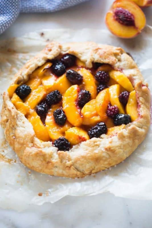 <p>Tastes Better from Scratch</p><p>This peach blackberry tart is pretty enough to seem “fancy” and impressive, but it couldn’t be easier to make! This a great easy dessert idea for your fresh summer peaches and blackberries.</p><p><strong>Get the recipe: <a href="https://tastesbetterfromscratch.com/peach-blackberry-tart/" rel="nofollow noopener" target="_blank" data-ylk="slk:Peach Blackberry Tart;elm:context_link;itc:0;sec:content-canvas" class="link rapid-noclick-resp">Peach Blackberry Tart</a></strong></p>