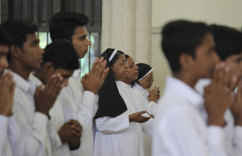 In this Sunday, Nov. 4, 2018, photo, senior nuns pray with others during Sunday mass at the Immaculate Heart of Mary Cathedral in Kottayam in the southern Indian state of Kerala. An AP investigation has uncovered a decades-long history of nuns in India enduring sexual abuse from within the Catholic church. (AP Photo/Manish Swarup)