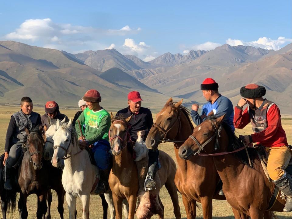 A group of men on horseback in Kyrgyzstan