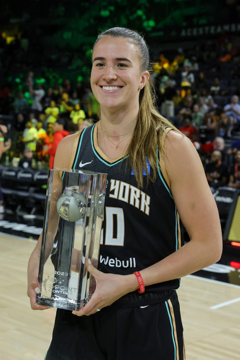 Sabrina Ionescu poses with the 3-Point Contest trophy during WNBA All-Star Friday ahead of the 2023 All-Star Game in Las Vegas.