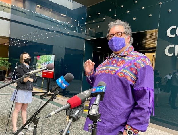 Calgary Mayor Naheed Nenshi said he's optimistic masks will soon no longer be required to keep people safe. But he's not confident that will be the case by July 1, when the province plans to drop nearly all COVID-19 regulations.   (Evelyne Asselin/CBC - image credit)