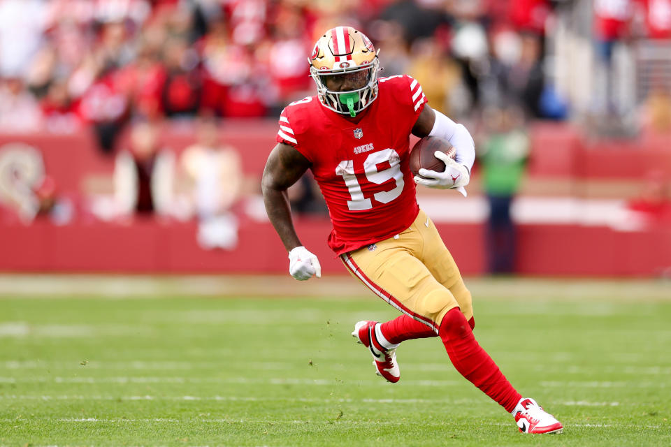 SANTA CLARA, CALIFORNIA - JANUARY 14: Deebo Samuel #19 of the San Francisco 49ers carries the ball against the Seattle Seahawks during the second half in the NFC Wild Card playoff game at Levi's Stadium on January 14, 2023 in Santa Clara, California. (Photo by Ezra Shaw/Getty Images)