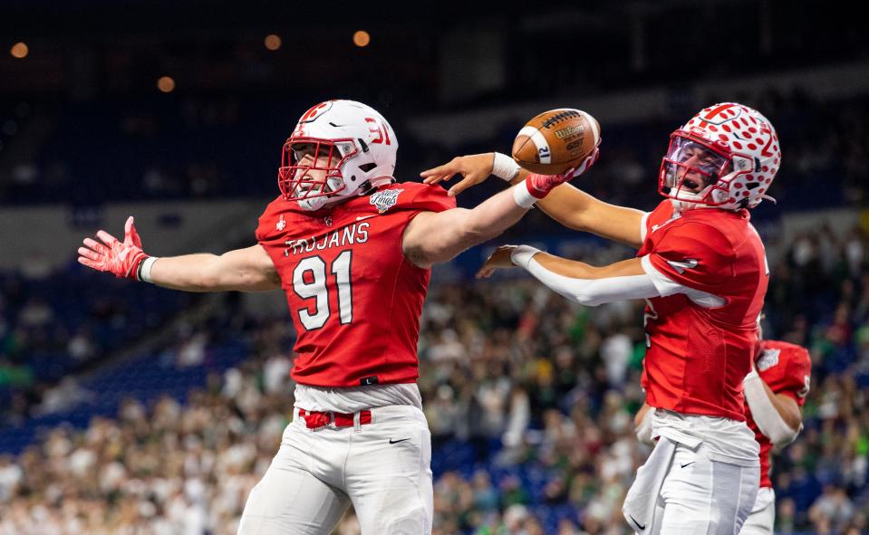 Center Grove High School senior Caden Curry (91) reacts after scoring a touchdown during the first half of an IHSAA class 6A State Championship football game against Westfield High School, Saturday, Nov. 27, 2021, at Lucas Oil Stadium