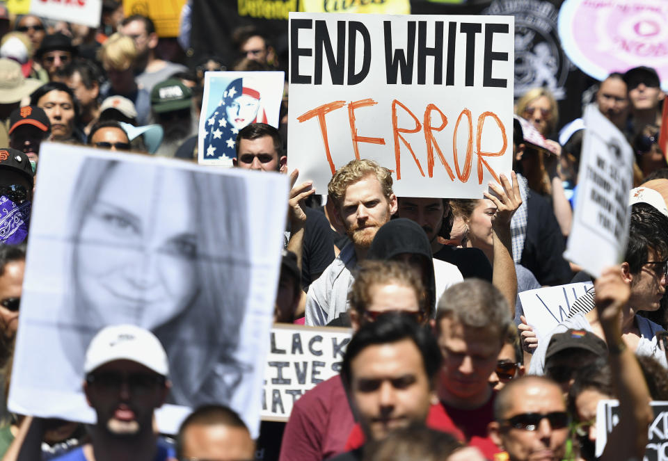 <p>Protesters march in San Francisco, Saturday, Aug. 26, 2017. Officials took steps to prevent violence ahead of a planned news conference by a right-wing group. (Photo: Josh Edelson/AP) </p>