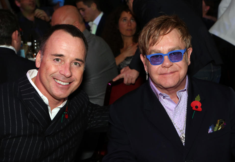 David Furnish, left, and Elton John are seen at the 2012 Music Industry Trusts Award ceremony at the Grosvenor House Hotel on Monday, Nov. 5, 2012, in London. (Photo by John Marshall JM Enternational/Invision/AP)