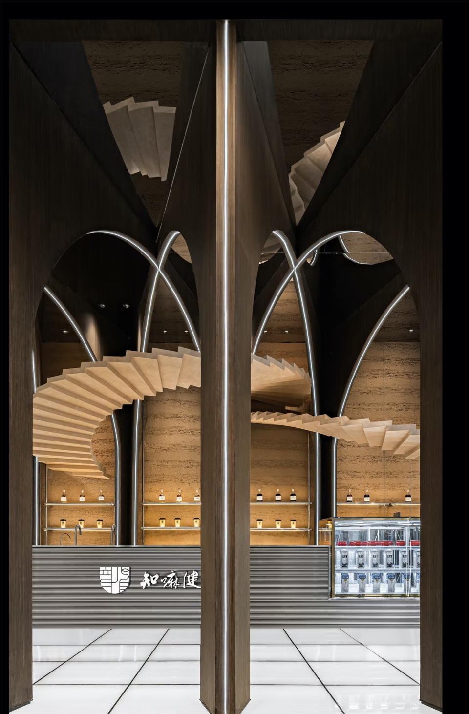 Upside-down staircases wrap through archways above the Zhima Health store's bar area.