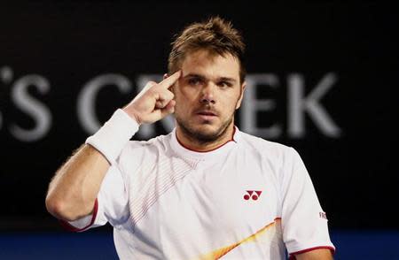 Stanislas Wawrinka of Switzerland reacts to going to 5-3 in the fourth set during his men's singles final match against Rafael Nadal of Spain at the Australian Open 2014 tennis tournament in Melbourne January 26, 2014. REUTERS/Petar Kujundzic