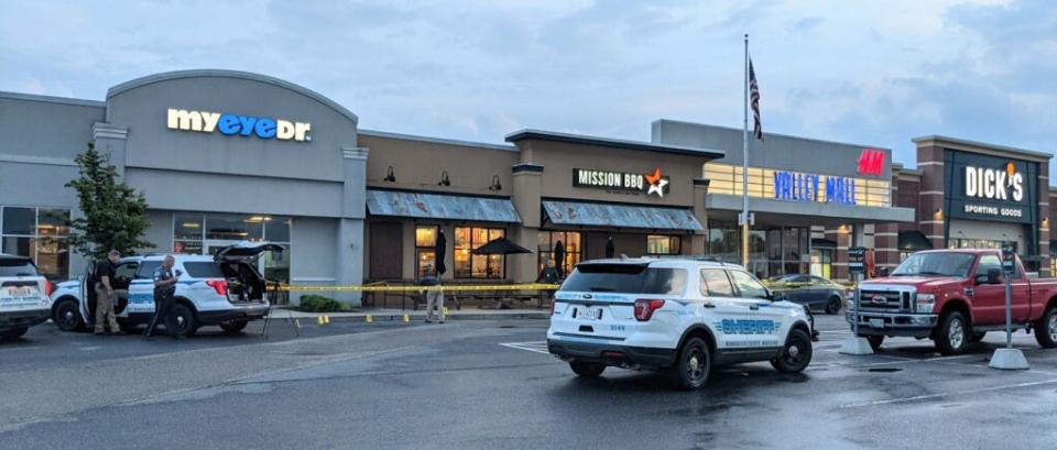 Washington County Sheriff's Office deputies investigate following a shooting Wednesday night outside Valley Mall in Halfway. One person was taken to the hospital, and two people were in custody, authorities said.