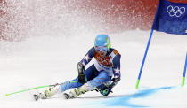 United States' Ted Ligety passes a gate in the first run of the men's giant slalom at the Sochi 2014 Winter Olympics, Wednesday, Feb. 19, 2014, in Krasnaya Polyana, Russia. (AP Photo/Luca Bruno)