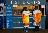 Nothing to see here, folks. Just some beers buying some fish and chips. (Photo by Peter Dench/Getty Images)