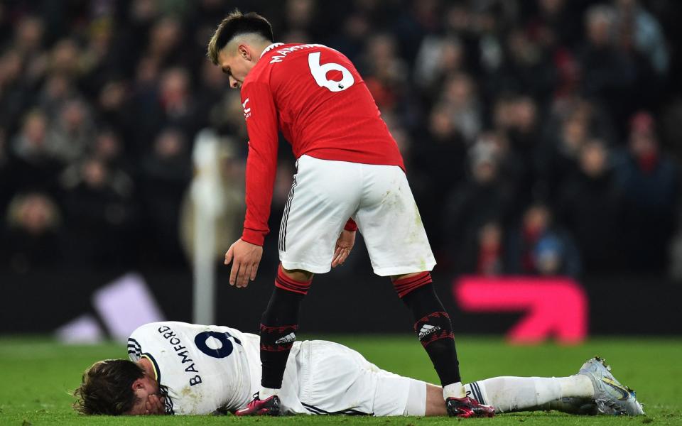 Leeds United's Patrick Bamford reacts as Manchester United's Lisandro Martinez looks on - Peter Powell/Reuters