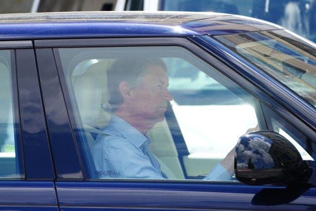 Vice Admiral Sir Tim Laurence is in the driver's seat of a car