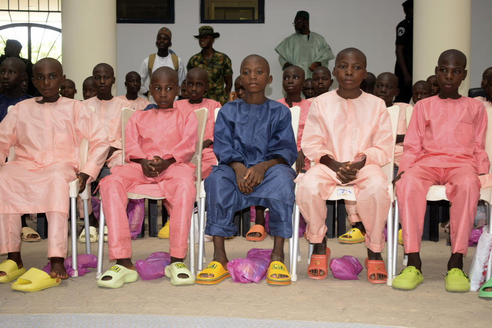 The freed students of the LEA Primary and Secondary School Kuriga upon their arrival at the state government house in Kaduna, Nigeria, Monday, March 25, 2024. More than 130 Nigerian schoolchildren rescued after more than two weeks in captivity have arrived in their home state in northwestern Nigeria ahead of their anticipated reunions with families. (AP Photo/Habila Darofai)