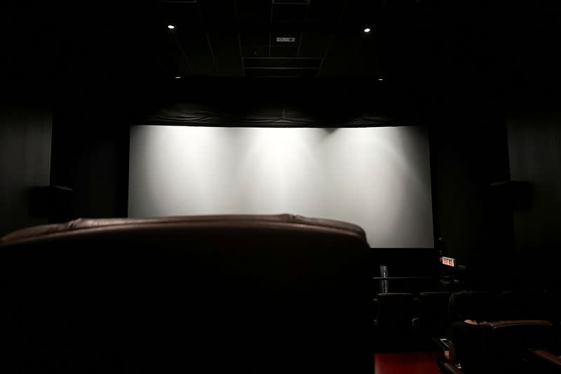 The projection screen is seen inside a cinema hall before the movie screening, in Hong Kong