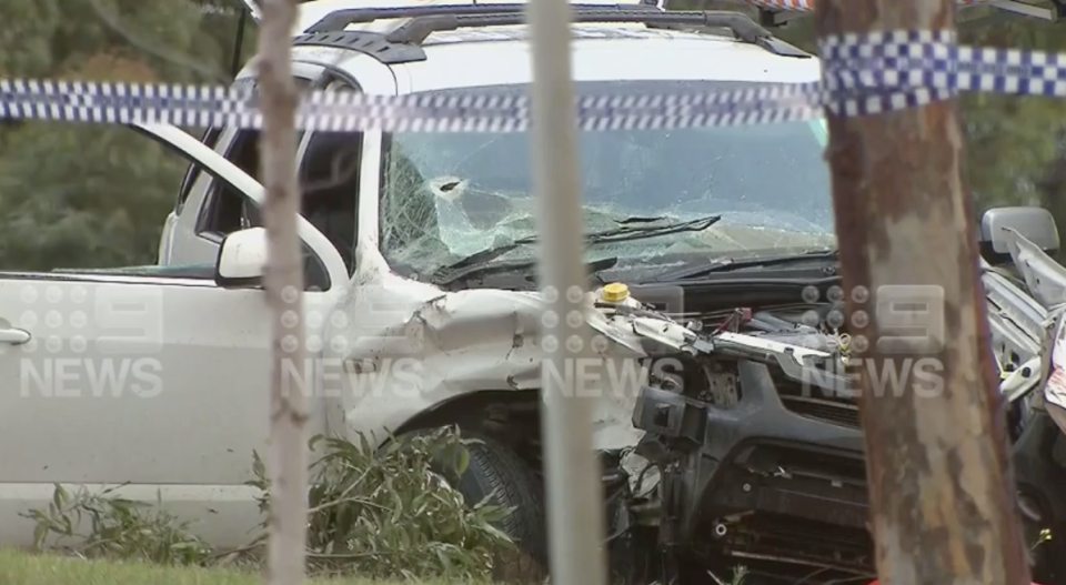 A smashed car with a bullet hole in the windshield on Princes Highway at Corio.