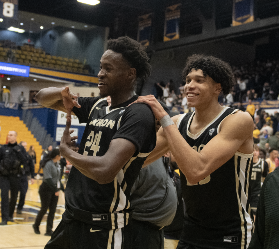 Akron's Ali Ali (24) and Enrique Freeman (25) walk off the court after a Zips win over Kent State on Jan. 19, 2024.