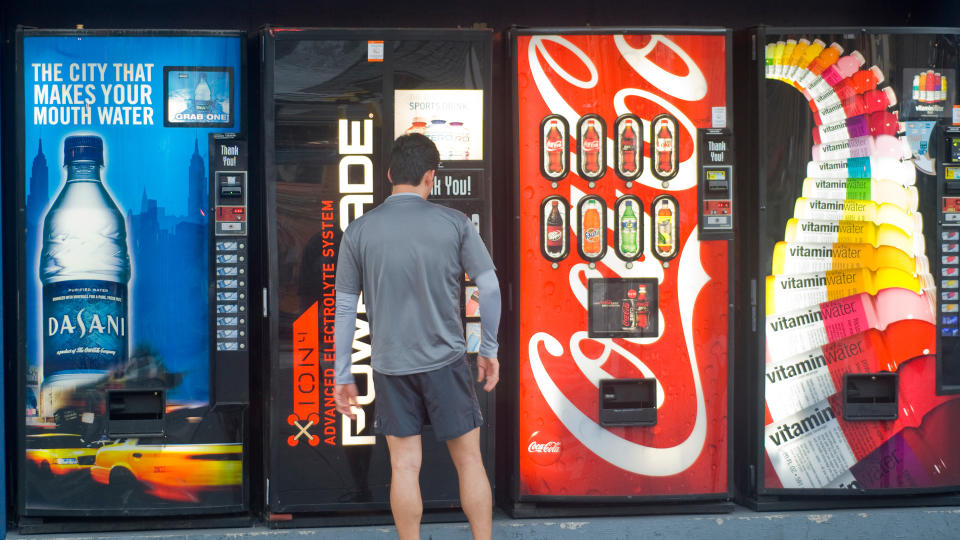 guy using vending machine