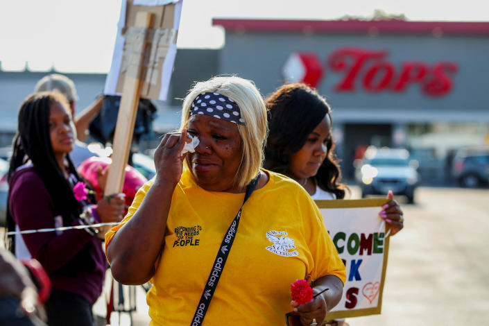 A woman wipes away tears while attending the reopening of the Tops Friendly supermarket in Buffalo, N.Y., on July 15.