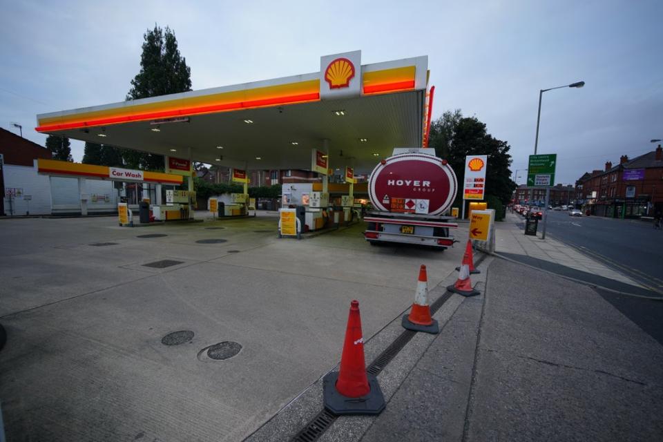 A petrol tanker delivers fuel to a Shell petrol station in Liverpool which was closed due to having no fuel (Peter Byrne/PA) (PA Wire)