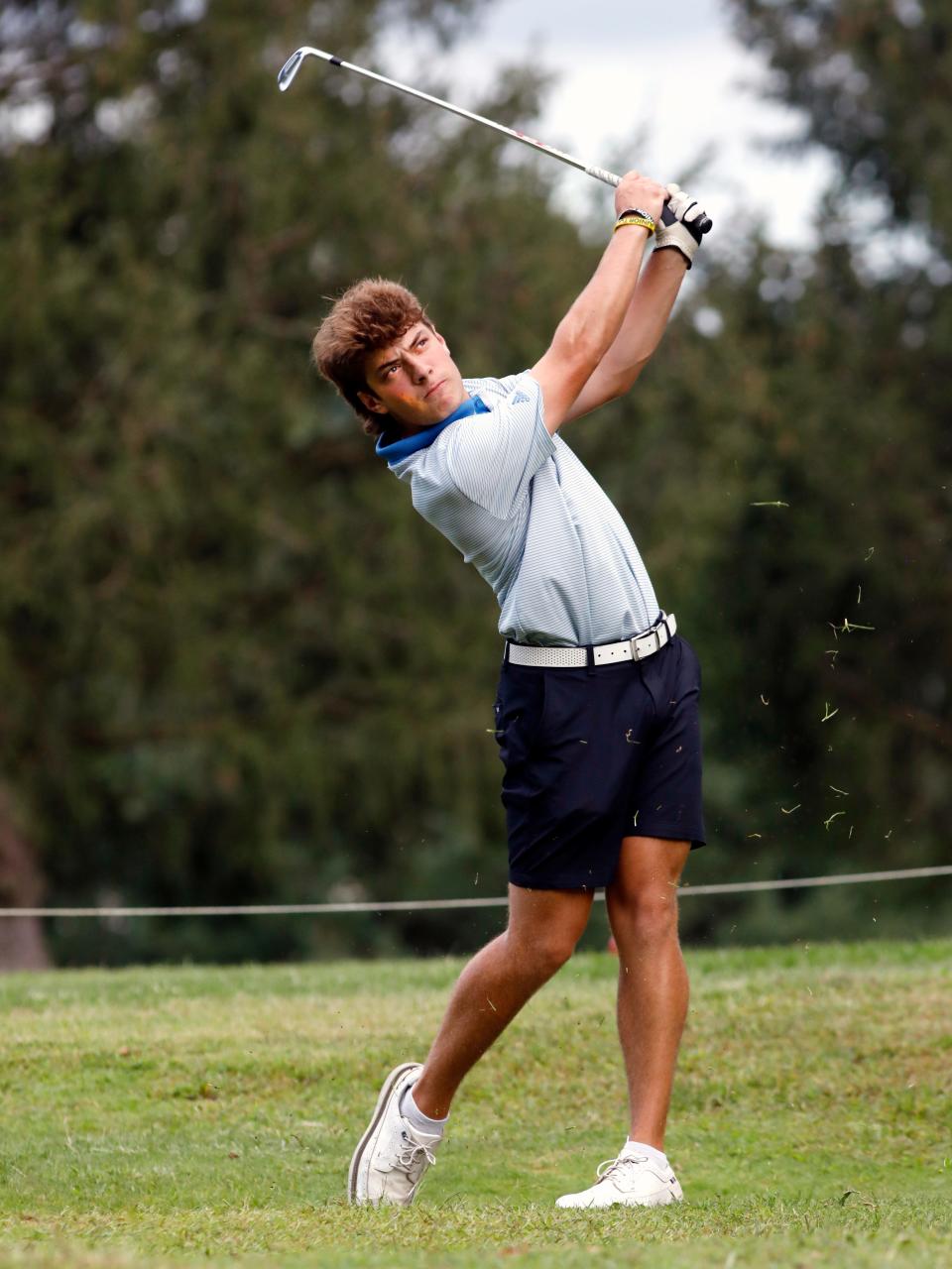 West Muskingum's Jack Porter stares down his tee shot on the par-3 eighth hole during a trimatch with John Glenn and Tri-Valley on Thursday at Zanesville Jaycees. Porter, a senior, shot 3-under-par 32 to earn medalist honors.