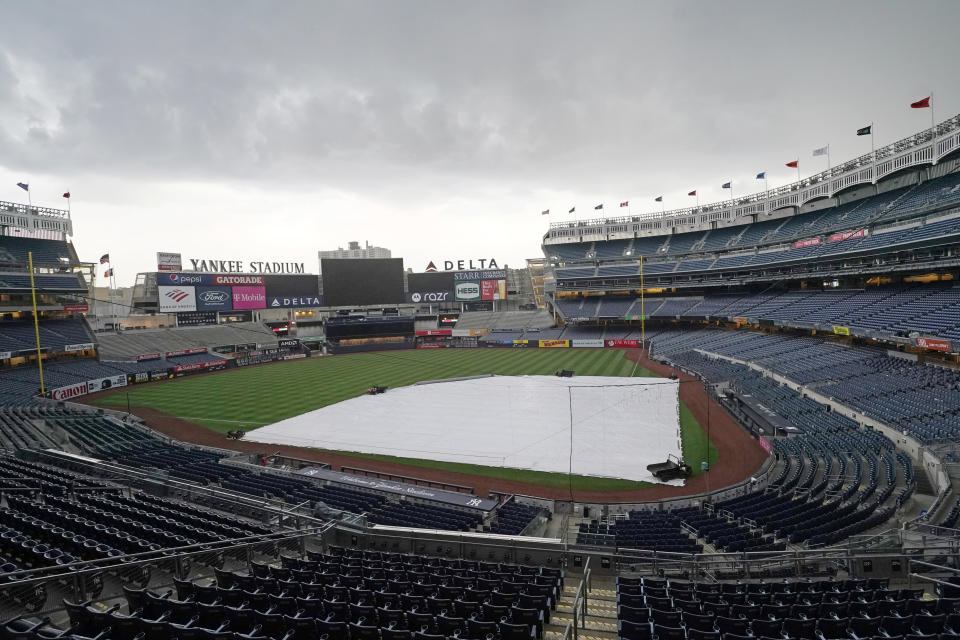 A storm approaches Yankee Stadium after a baseball game between the Toronto Blue Jays and the New York Yankees was postponed due to predicted inclement weather, Wednesday, May 26, 2021, in New York. (AP Photo/Kathy Willens)