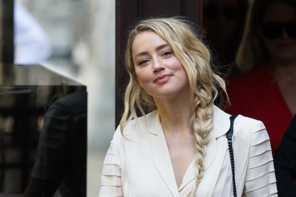 Amber Heard arrives at the Royal Courts of Justice on the tenth day of the hearing on the libel case against The Sun newspaper on 20 July, 2020 in London, England. Amber Heard is due to testify as a witness for The Sun's publisher, News Group Newspapers, as Johnny Depp is suing the newspaper over a 2018 article in which he was accused of being violent towards her during their marriage. (Photo by WIktor Szymanowicz/NurPhoto via Getty Images)