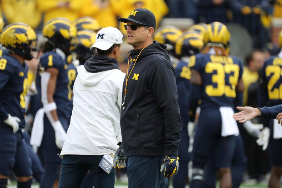 Michigan Wolverines head coach Jim Harbaugh watches warmups before action against the Penn State Nittany Lions at Michigan Stadium, Saturday, October 15, 2022.