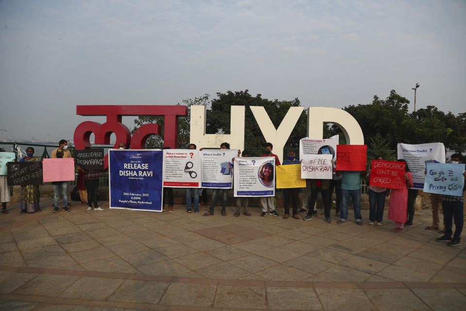 Activists participate in a silent protest against the arrest of environmental activist Disha Ravi in Hyderabad, India, Saturday, Feb. 20, 2021. The 22-year-old Indian climate activist who is facing sedition charges for her alleged role in the creation of an online document intended to help amplify farmer protests did not get bail Saturday after a court said it will reserve its order for next week. (AP Photo/Mahesh Kumar A.)