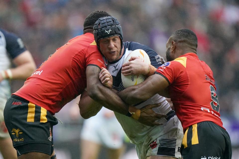 Chris Hill tangles with Papua New Guinea’s Wellington Albert (left) and Edwin Ipape during England’s quarter-final (PA Images/Tim Goode) (PA Wire)