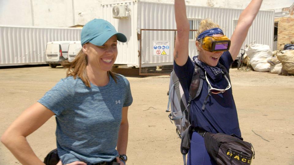 New Berlin firefighter Bizzy Smith (right) celebrates after her partner Sunny Pulver completes a welding Roadblock task as fellow racer Melissa Main looks on during the seventh episode of "The Amazing Race" that aired on Wednesday, April 24, 2024.