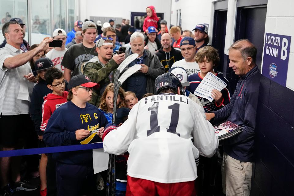 Jul 2, 2023; Columbus, Ohio, USA;  Adam Fantilli (11) signs autographs and takes photos following the first day of the Columbus Blue Jackets development camp at the OhioHealth Chiller North in Lewis Center. 