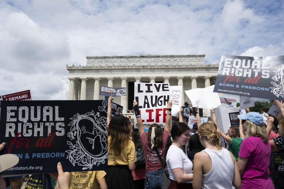 Anti-abortion activists rally at the National Celebrate Life Rally at the Lincoln Memorial on Saturday, June 24, 2023, in Washington. (AP Photo/Kevin Wolf)