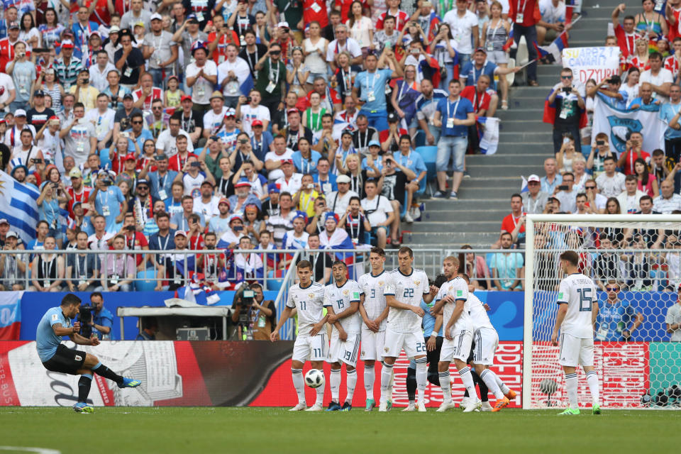 <p>Suarez opens the scoring with a fine free-kick </p>