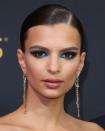 <p>Peacock blue metallic eyes make a massive statement with slicked back hair and the rest of your make-up pared back.</p>