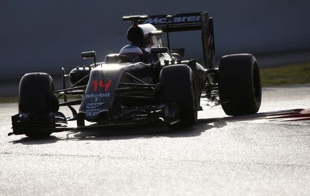 McLaren Formula One driver Fernando Alonso of Spain take a curve with his car during the second testing session ahead of the upcoming season at the Circuit Barcelona-Catalunya in Montmelo, Spain, February 23, 2016. REUTERS/Sergio Perez