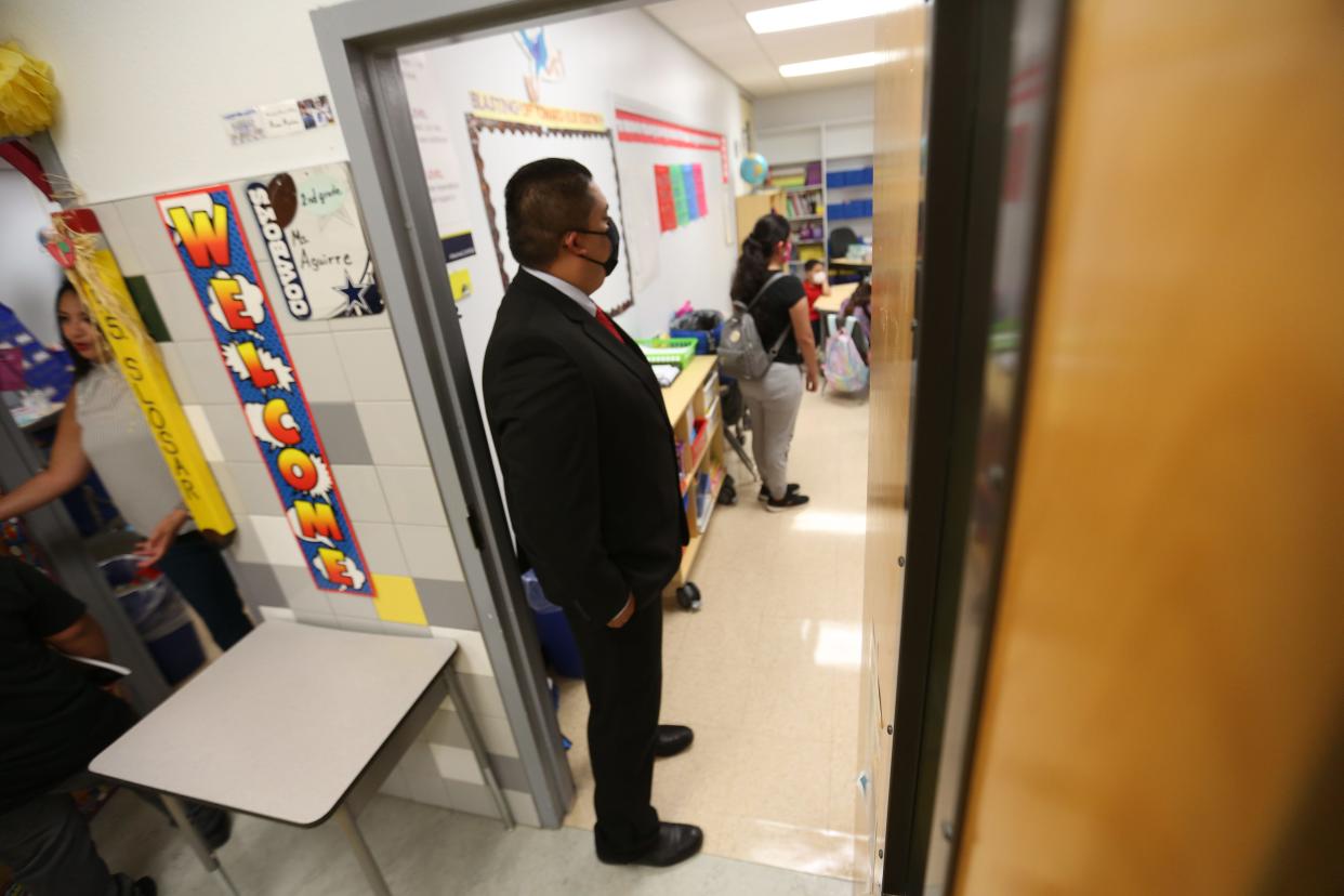 Montana Vista Elementary School Principal Eric Villalba checks in on classrooms as students and teachers get settled on the first day of school Monday, July 26, 2021, in El Paso. Clint ISD reopened to fully in-person learning for the first time in over a year. The COVID-19 pandemic forced school closures and the school district transitioned to remote learning last spring.