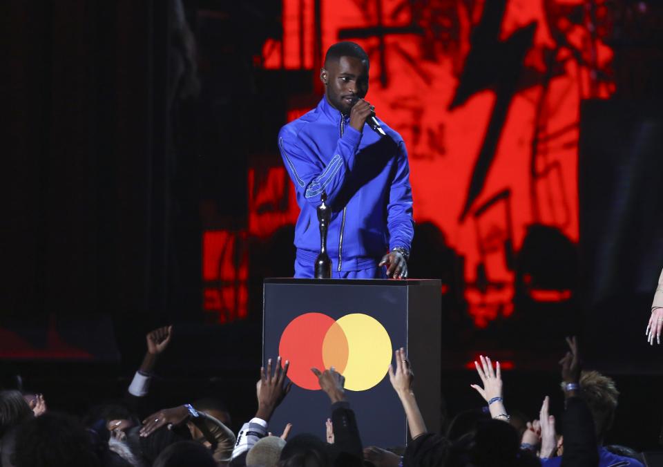 Dave accepts the award for Album of the Year on stage at the Brit Awards 2020 in London, Tuesday, Feb. 18, 2020. (Photo by Joel C Ryan/Invision/AP)