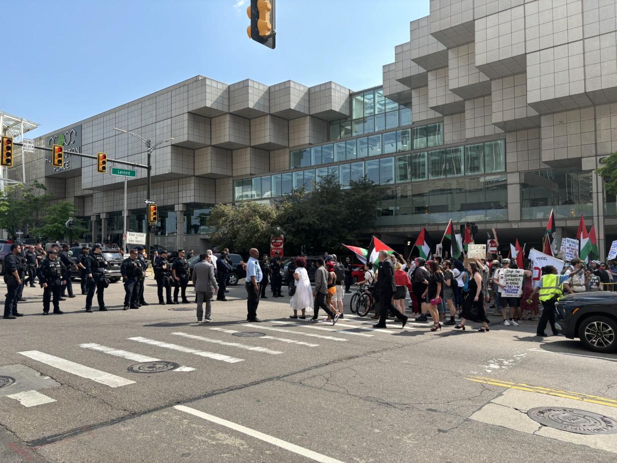 Protesters march outside Huntington Place on May 19, 2024, where President Joe Biden is expected to speak to a crowd gathered for the NAACP's 69th annual Fight for Freedom Fund Dinner.