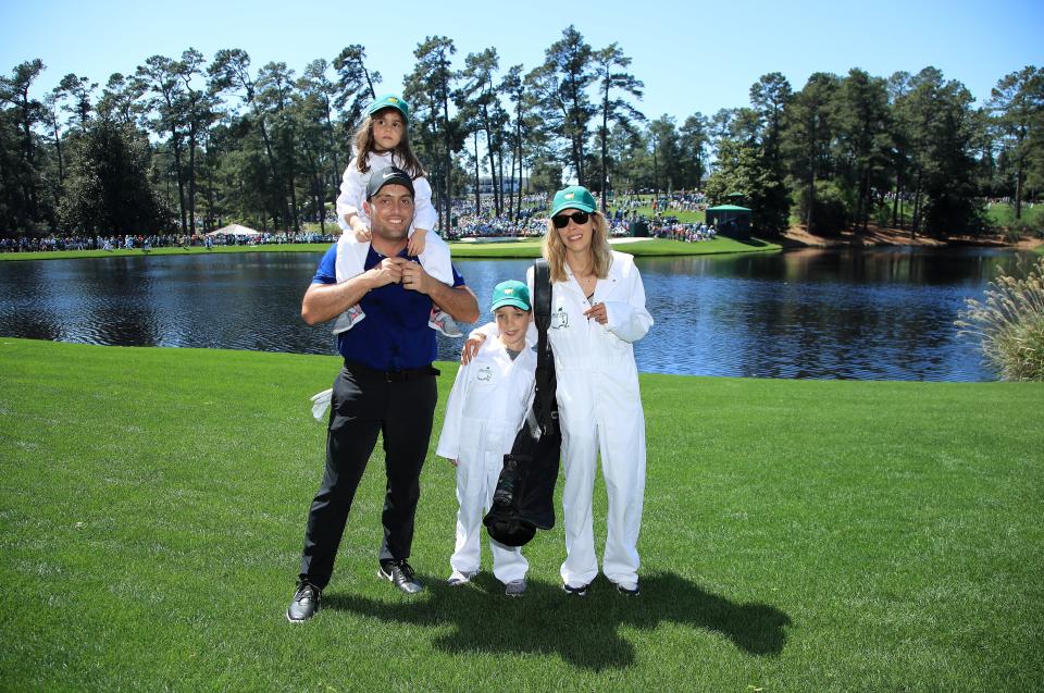 AUGUSTA, GEORGIA - APRIL 10: Francesco Molinari of Italy stands with wife Valentina Molinari and their children during the Par 3 Contest prior to the Masters at Augusta National Golf Club on April 10, 2019 in Augusta, Georgia. (Photo by Andrew Redington/Getty Images)