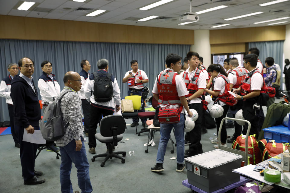 Medical volunteers prepare for their duties on the remaining protesters at Polytechnic University in Hong Kong, Tuesday, Nov. 26, 2019. Hong Kong’s embattled leader Carrie Lam refused to offer any concessions to anti-government protesters despite a local election setback, saying Tuesday that she will instead accelerate dialogues and identify ways to address societal grievances. (AP Photo/Vincent Thian)