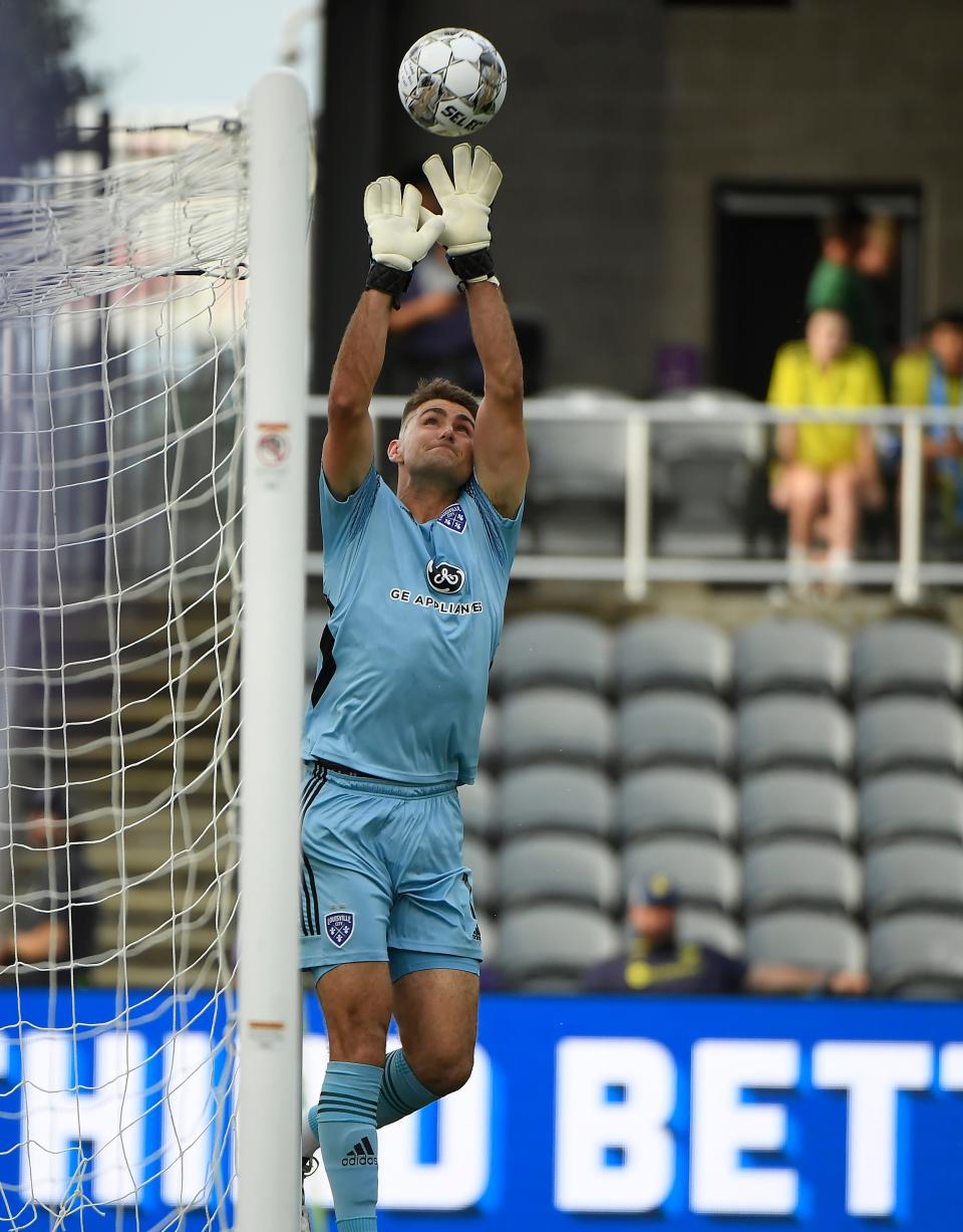 May 25, 2022; Louisville, Kentucky, USA;  Louisville City FC goalkeeper Kyle Morton (1) deflects a shot against the Nashville SC during the first half at Lynn Family Stadium. Mandatory Credit: Steve Roberts-USA TODAY Sports