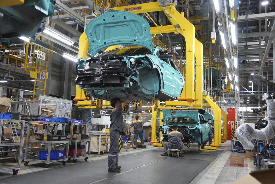 Workers assemble a car at a Vinfast factory in Hai Phong, Vietnam, on Sept. 29, 2023. Vietnamese automaker Vinfast has plunged right into the crowded and hypercompetitive U.S. auto market, gambling that if it can sell its electric vehicles to finicky Americans, it can succeed anywhere. So far, that gamble has yet to pay off. (AP Photo/Hau Dinh)