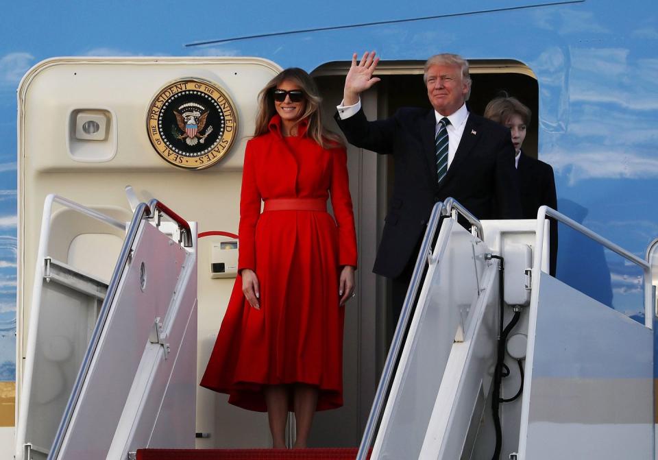 <p>Pictured here departing Air Force One after touching down in Mar-A-Lago on March 17, 2017, Melania wore this high-collared red dress by Alice Roi and tied the look together with nude pumps by Italian shoe designer by Gianvito Rossi. </p>
